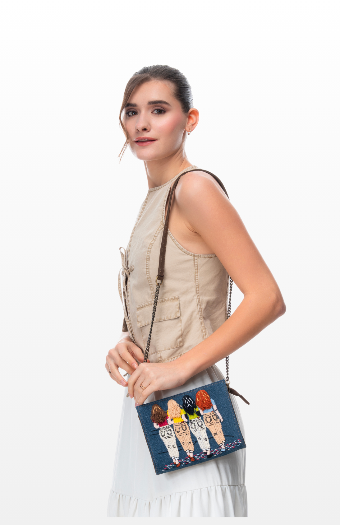 Woman wearing Forever Friends sling purse by the brand Story of Strings.