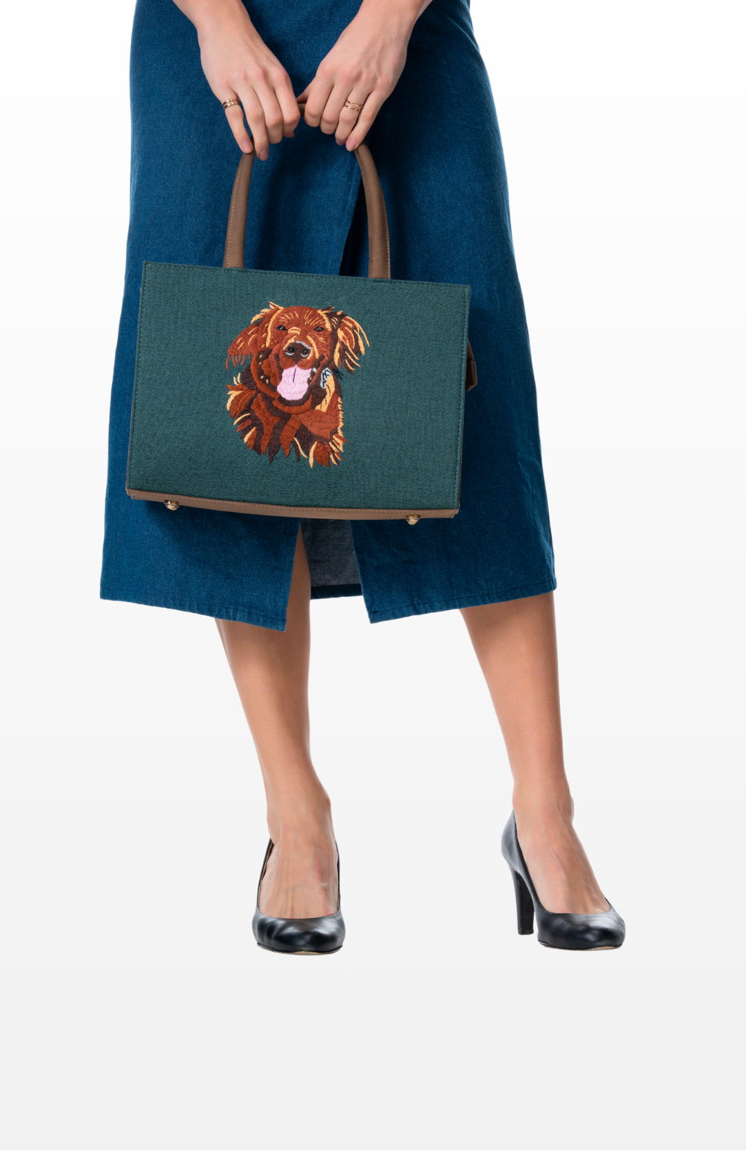 Woman holding a Fur-Ever Mine (Teal) tote bag by the brand Story of Strings.