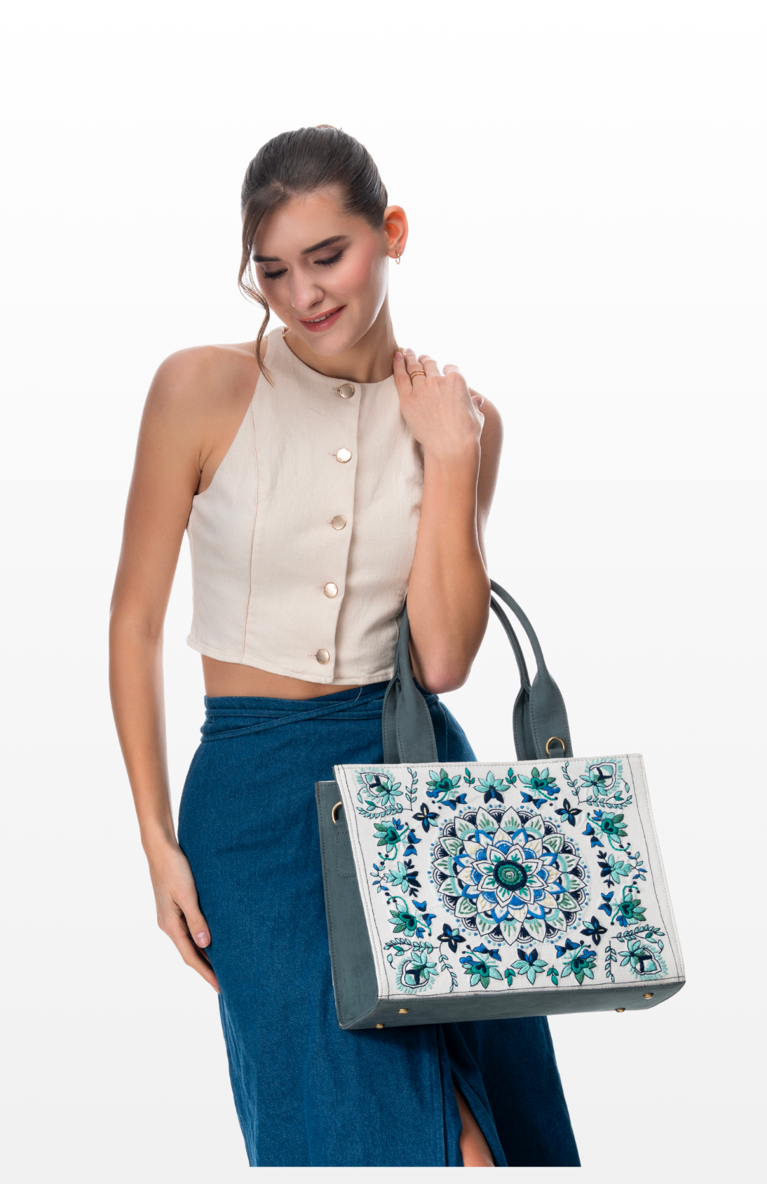 Woman wearing Mandala Magic tote bag by the brand Story of Strings.
