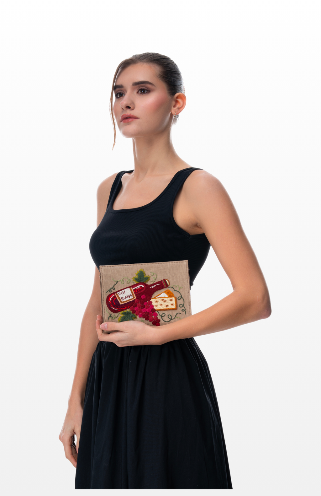 Woman holding Perfect Pairing sling purse by the brand Story of Strings.
