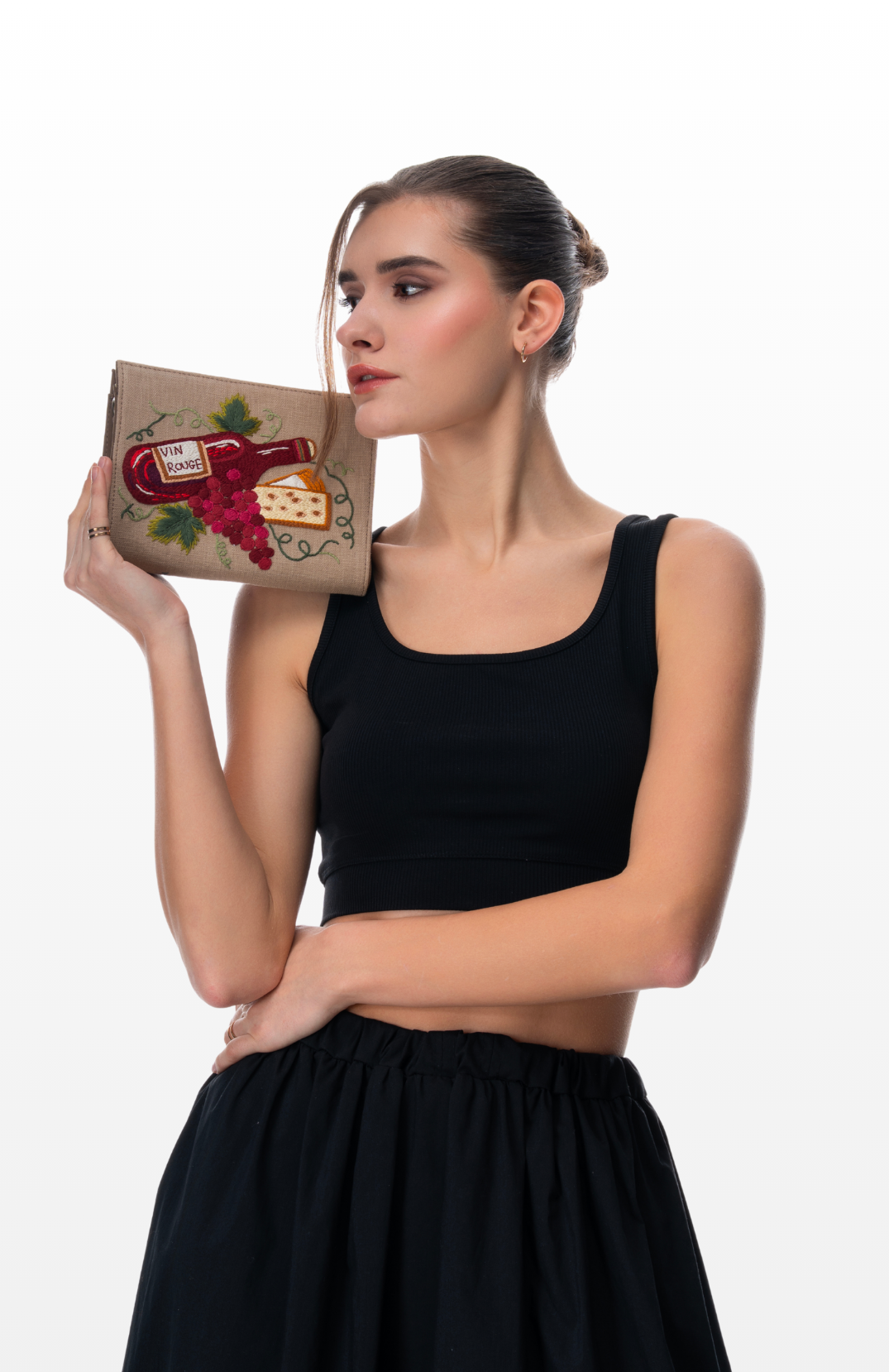 Woman holding Perfect Pairing sling purse by the brand Story of Strings.