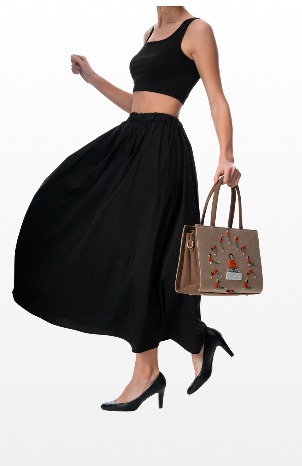 Woman holding Rhythm of Light tote bag by the brand Story of Strings.