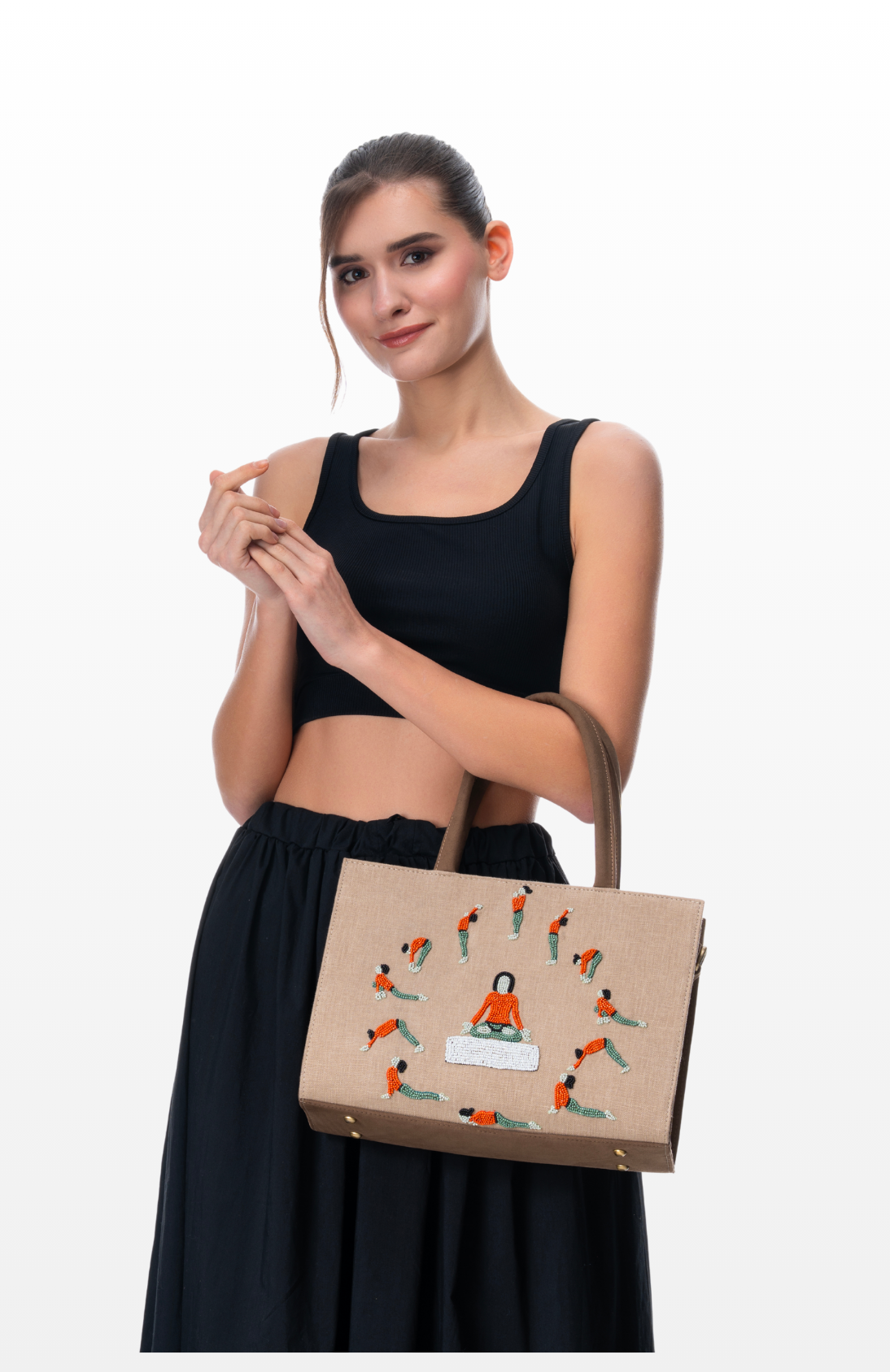 Woman wearing Rhythm of Light tote bag by the brand Story of Strings. 