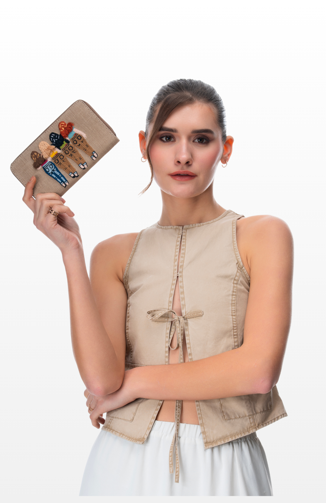 Woman holding a wallet Sister Soulmates by the brand Srory of Strings.