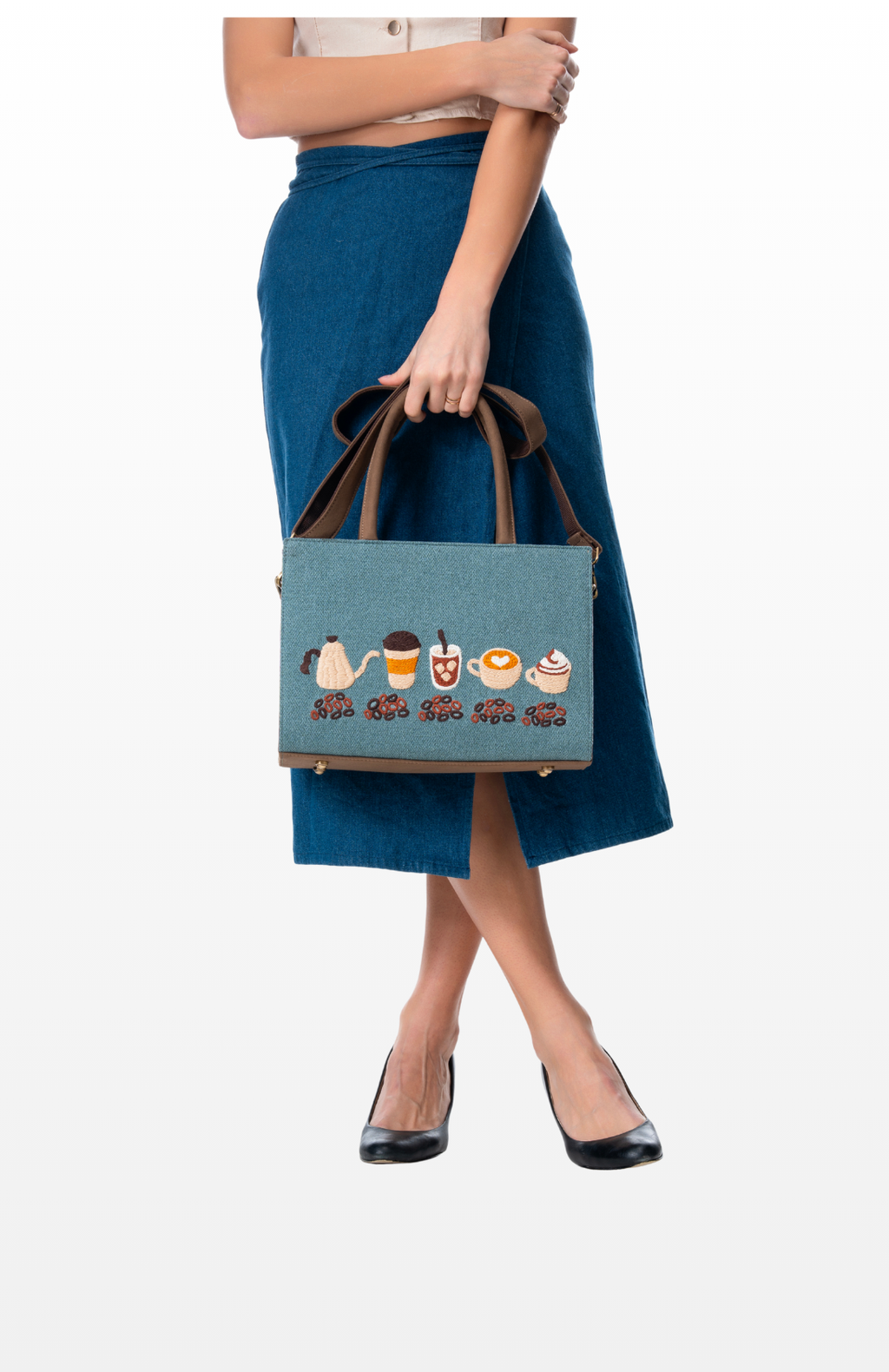 Woman holding Slow Roasted Coffee tote bag by the brand Story of Strings.