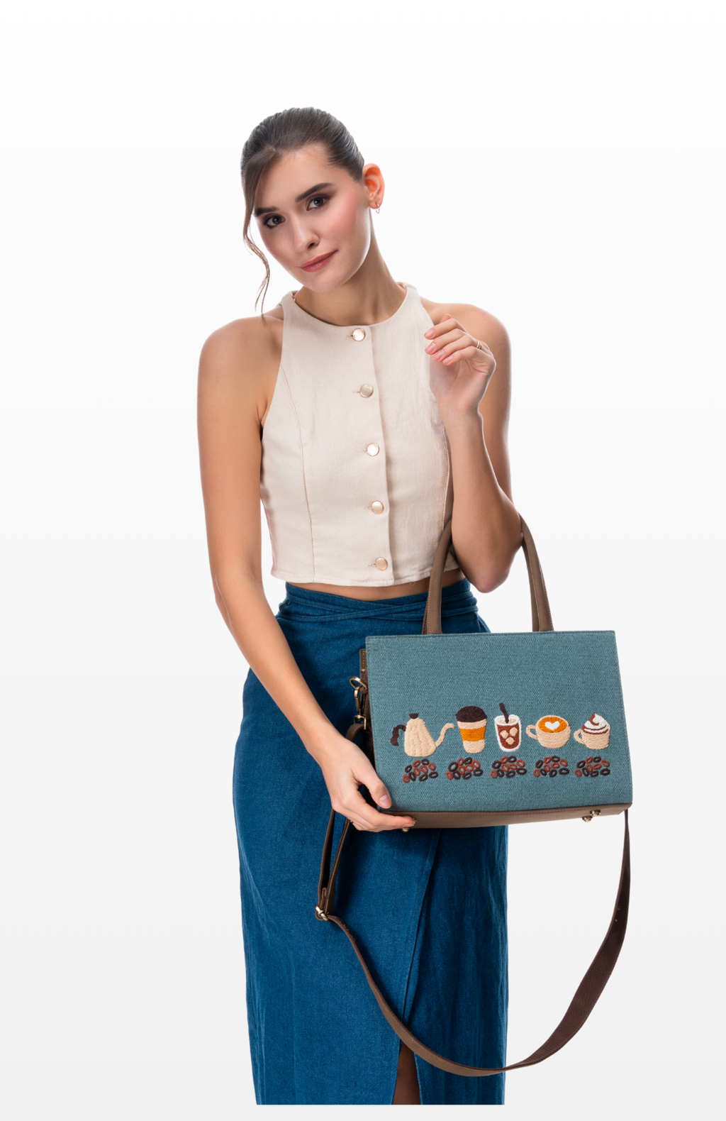 Woman carrying Slow Roasted Coffee tote bag by the brand Story of Strings.