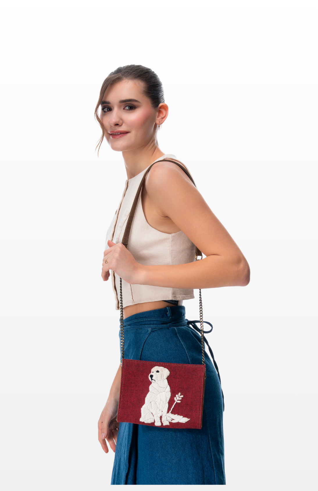 Woman wearing The Loyal Love sling purse by the brand Story of Strings.