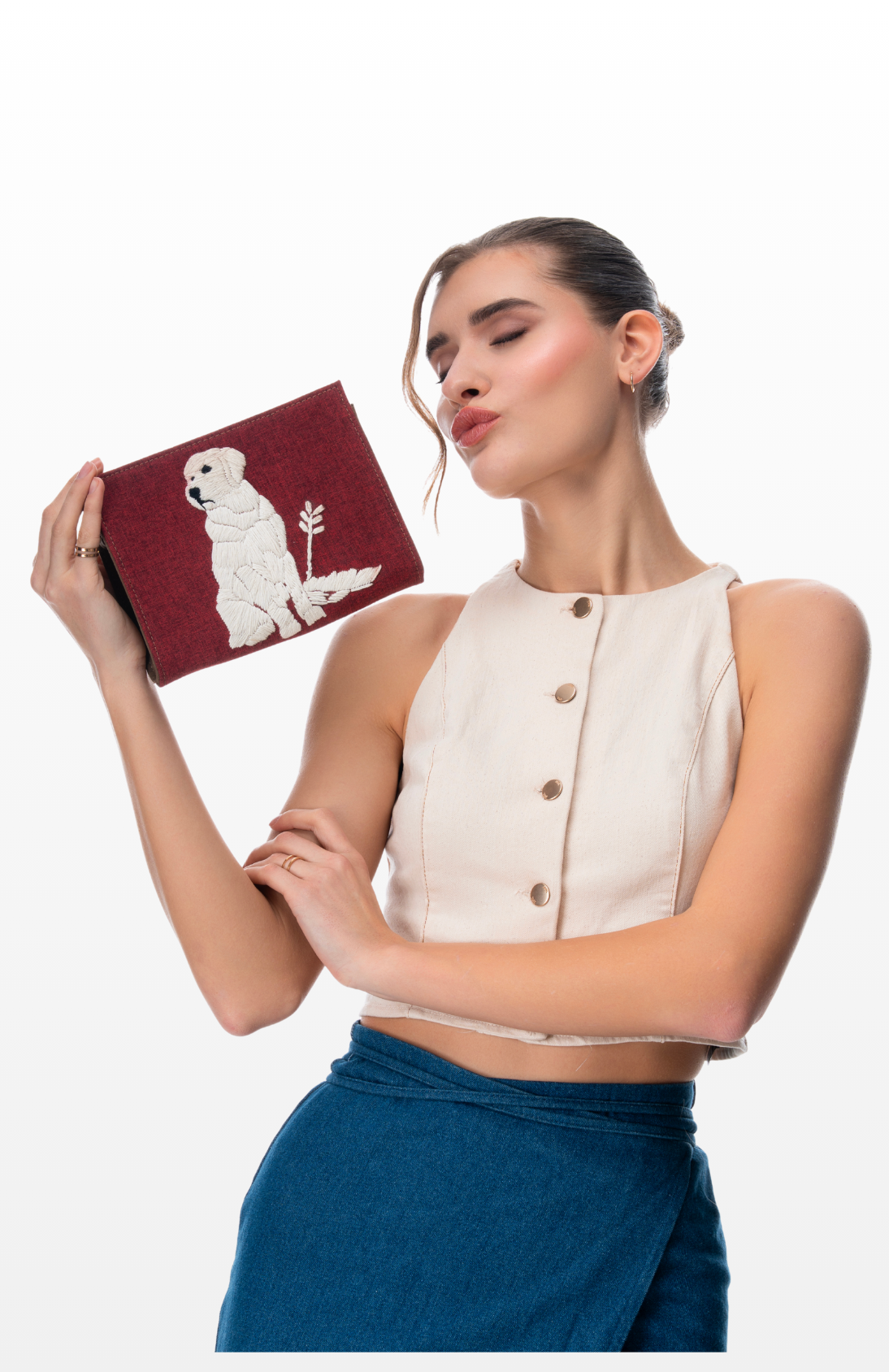 Woman holding The Loyal Love sling purse by brand Story of Strings.