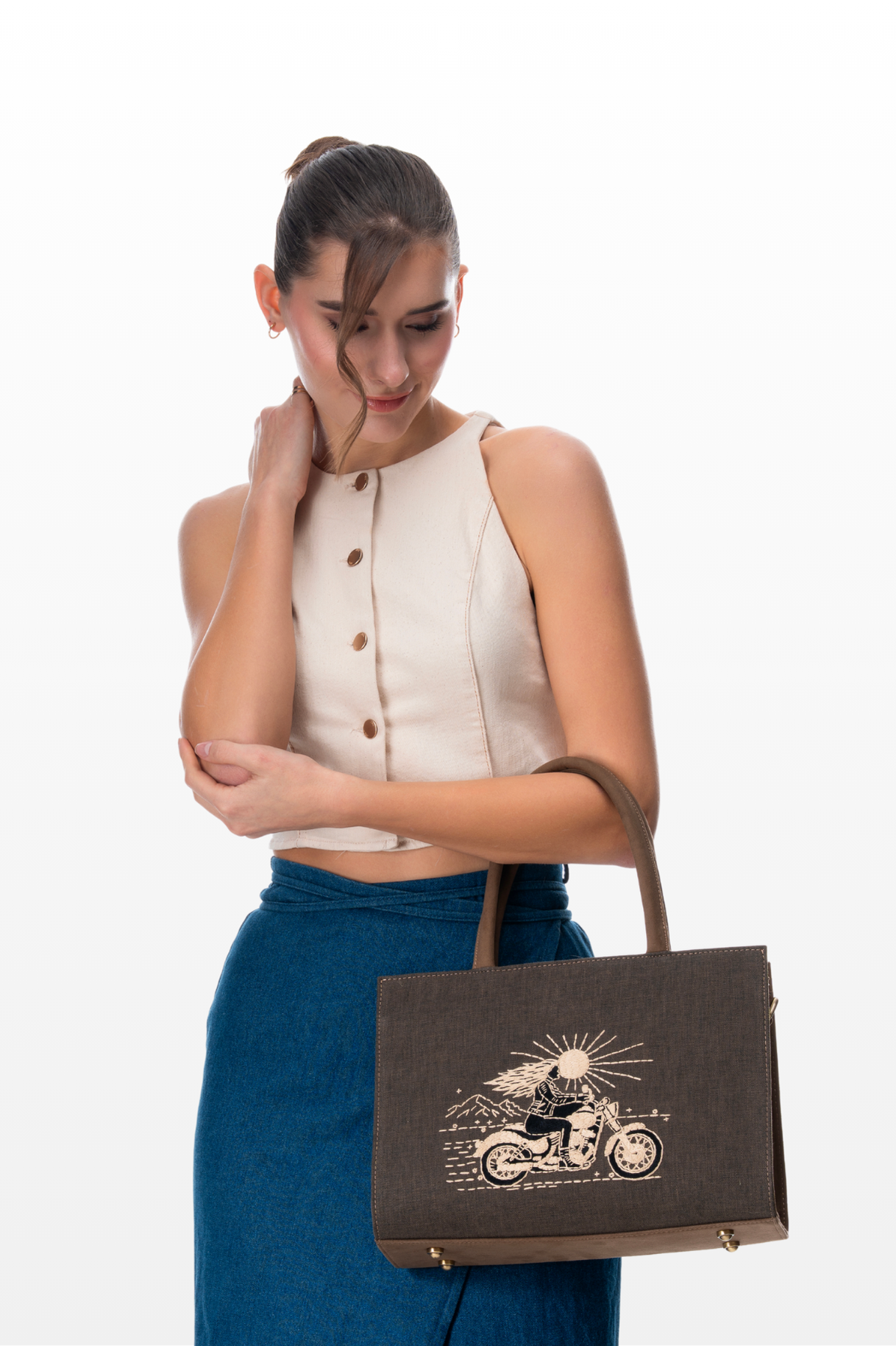 Woman wearing The Silver Road medium handbag by the brand Story of Strings 