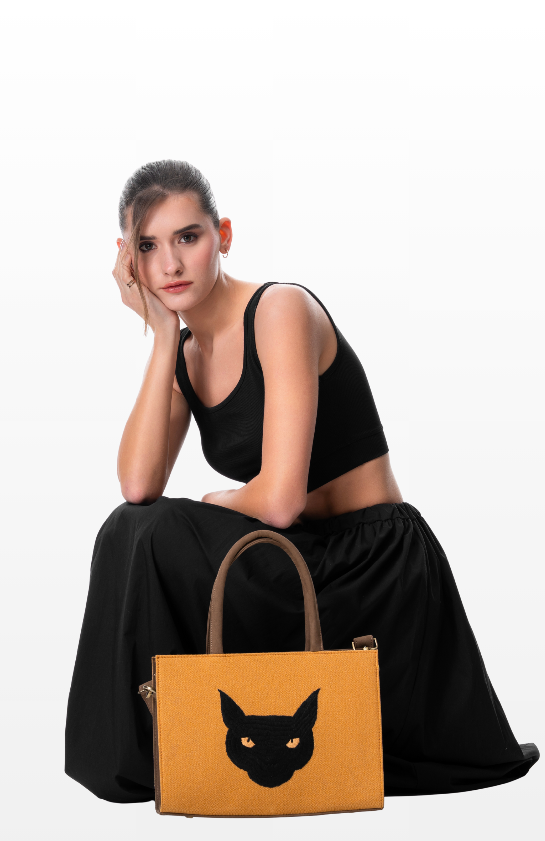 A woman with Topaz Gaze tote bag by the brand Story of Strings.