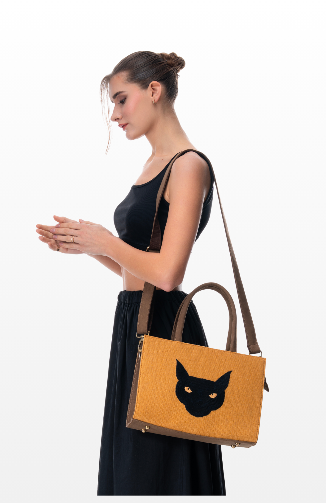Woman wearing Topaz Gaze tote bag by the brand Story of Strings.